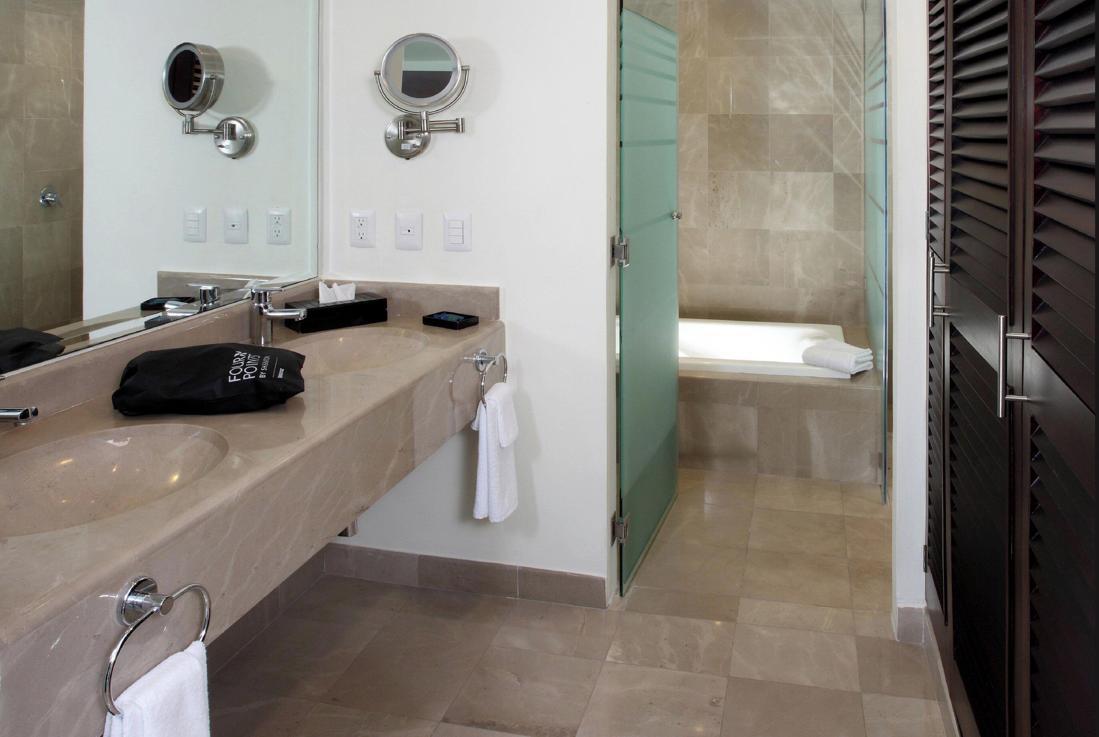 suite, 1 king bed with sofa bed, balcony, partial ocean view (balcony) | bathroom | shower, free toiletries, hair dryer, towels