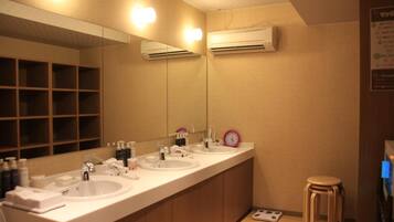 Shower, hair dryer, slippers, towels