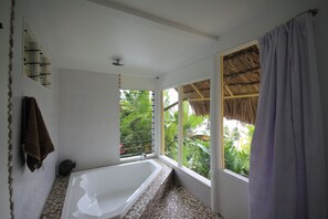 Bathtub, hair dryer, towels, soap