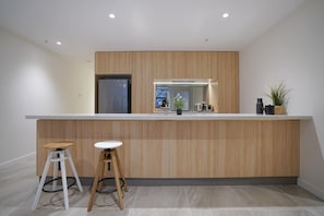 Enjoy cooking in this well-equipped kitchen with a sink and refrigerator.