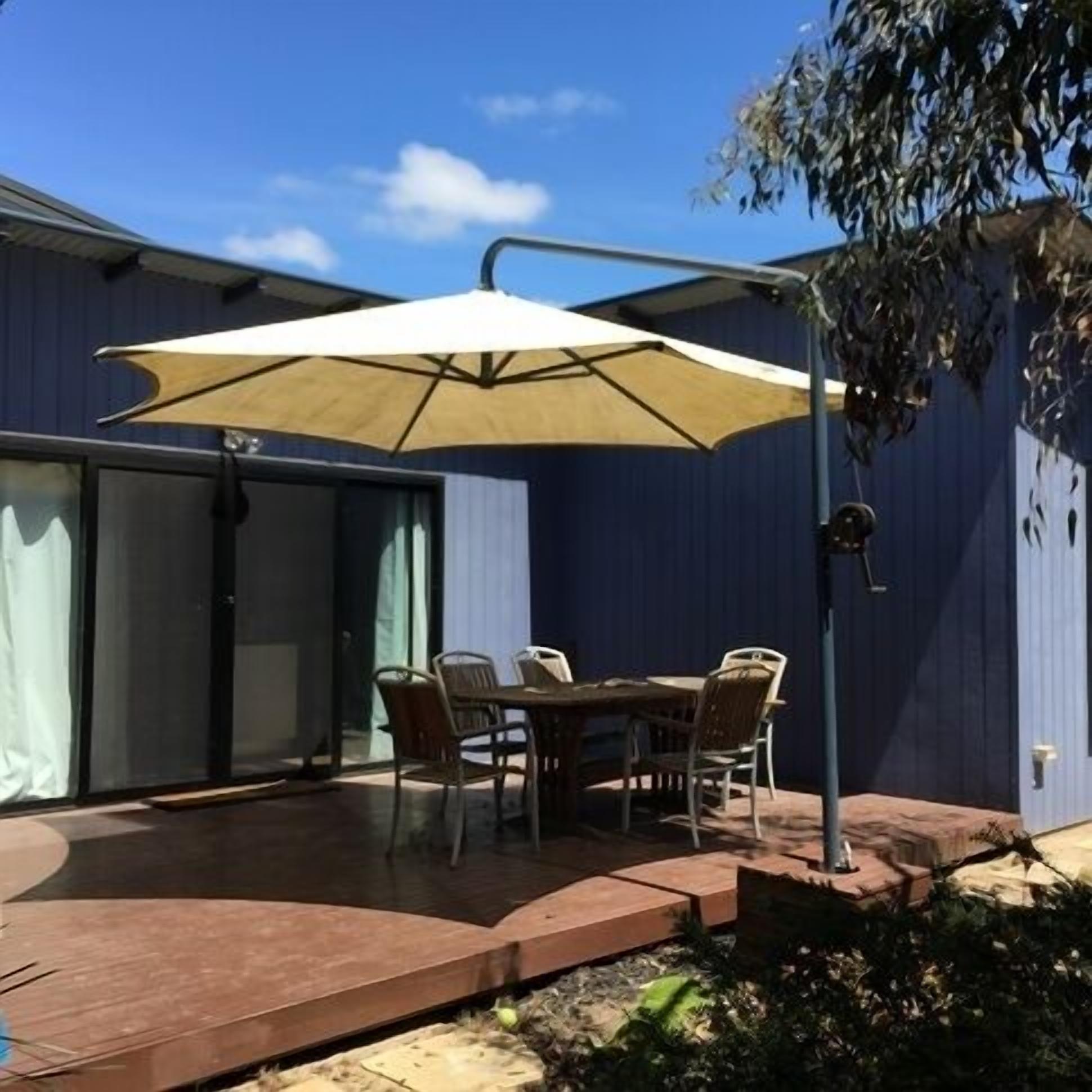 Shady large timber deck with outdoor setting. Fire up the gas BBQ