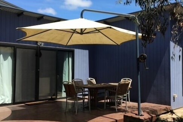 Shady large timber deck with outdoor setting. Fire up the gas BBQ