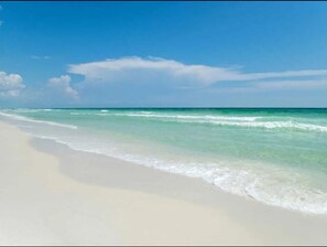 On the beach, sun-loungers, beach umbrellas, beach towels