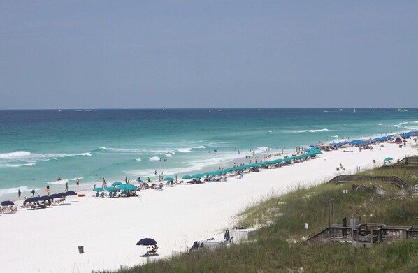 On the beach, sun-loungers, beach umbrellas, beach towels