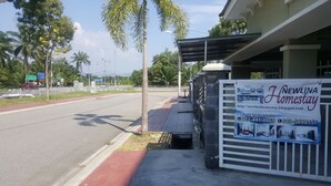 A property named Newlina Homestay with a signboard displaying contact information and a website URL. - NEWLINA HOMESTAY, Nibong Tebal, Seberang Perai Selatan, Penang, Malaysia. (Nibong Tebal)