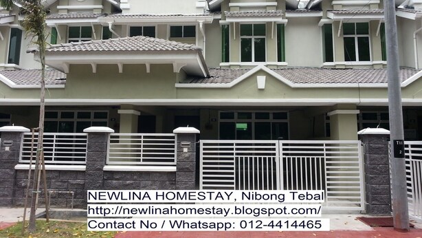 A two-story residential building with a symmetrical facade, featuring a central entrance flanked by windows and a small balcony. - NEWLINA HOMESTAY, Nibong Tebal, Seberang Perai Selatan, Penang, Malaysia. (Nibong Tebal)