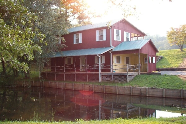 View of Cottage and small pond at lower level