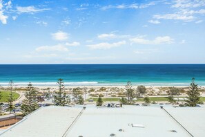 A beach view from a rooftop with a clear sky. - Apartment M601 - Spectacular Beachfront Penthouse! (Scarborough)