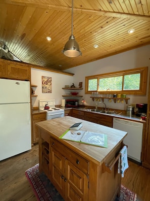 Enjoy cooking in this well-equipped kitchen with a central island and ample counter space.