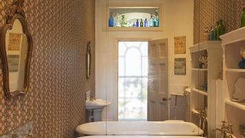 Bathtub, hair dryer, towels, soap