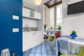 Fridge, coffee/tea maker, toaster, cookware/dishes/utensils