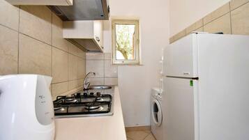 Fridge, cookware/dishes/utensils, dining tables