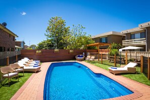 Outdoor pool, open 9:00 AM to 6:00 PM, pool umbrellas, pool loungers