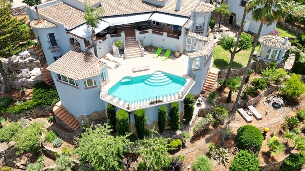 A large, multi-story house with a swimming pool, outdoor seating, and a well-maintained garden. - Exclusive private dream villa Finca holiday house with pool, Berg.-, sea view and many more. (El Ràfol d'Almúnia)