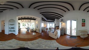 A spacious living area with a high ceiling, tiled flooring, and a central seating area with a sofa and chairs. - Exclusive private dream villa Finca holiday house with pool, Berg.-, sea view and many more. (El Ràfol d'Almúnia)