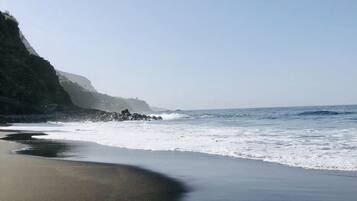 On the beach, sun-loungers