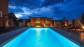 Outdoor pool, a heated pool, sun loungers