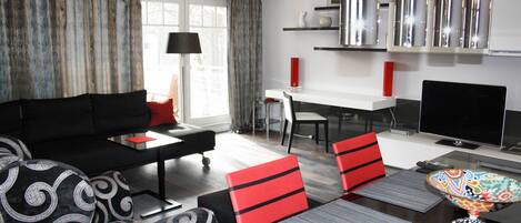 Flat-screen TV, books, stereo