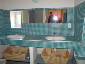 A bathroom with two sinks, a mirror, and a window. - Sheepfold in Languedoc with a private pool (Montoulieu)