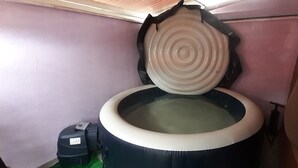 A toilet with a circular seat and a lid that has concentric circles.