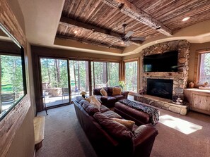 Smart TV, fireplace, table football, books