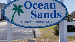A sign for Ocean Sands, a private community. - BEACH TIME!  Ocean side! Private area, no crowds - Steps from sand.  Downstairs. (Atlantic Beach)