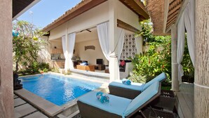 A poolside area with lounge chairs, a covered seating area, and a view of the pool. - Peaceful, Cozy Villa with Private Pool and Good Internet (Mia) (Pererenan)