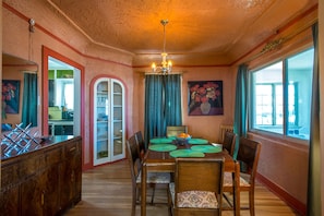 Enjoy meals in this cozy dining area with a traditional table and comfortable chairs.