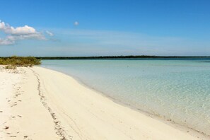 On the beach, sun loungers, beach towels