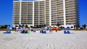 A large hotel with multiple balconies and a sandy beach in front. - Admirals Quarters 4BR..4BA, 2120sf, STUNNING VIEWS (Orange Beach)