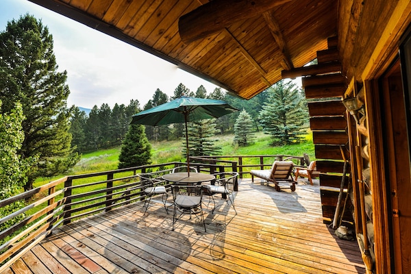 South facing deck. Wrought iron table/chairs , umbrella, & lounge chairs