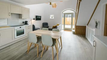 Apartment, 2 Bedrooms | Living area | 39-inch flat-screen TV with cable channels, Smart TV