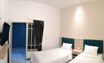 Habitación estándar con 2 camas individuales, 2 camas individuales | Escritorio, wifi gratis, ropa de cama y accesible en silla de ruedas