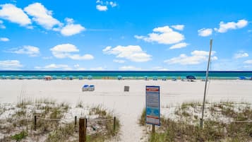 On the beach, sun-loungers