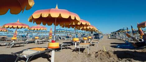 Beach nearby, white sand, sun loungers, beach umbrellas