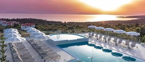 Indoor pool, seasonal outdoor pool, pool umbrellas, sun loungers