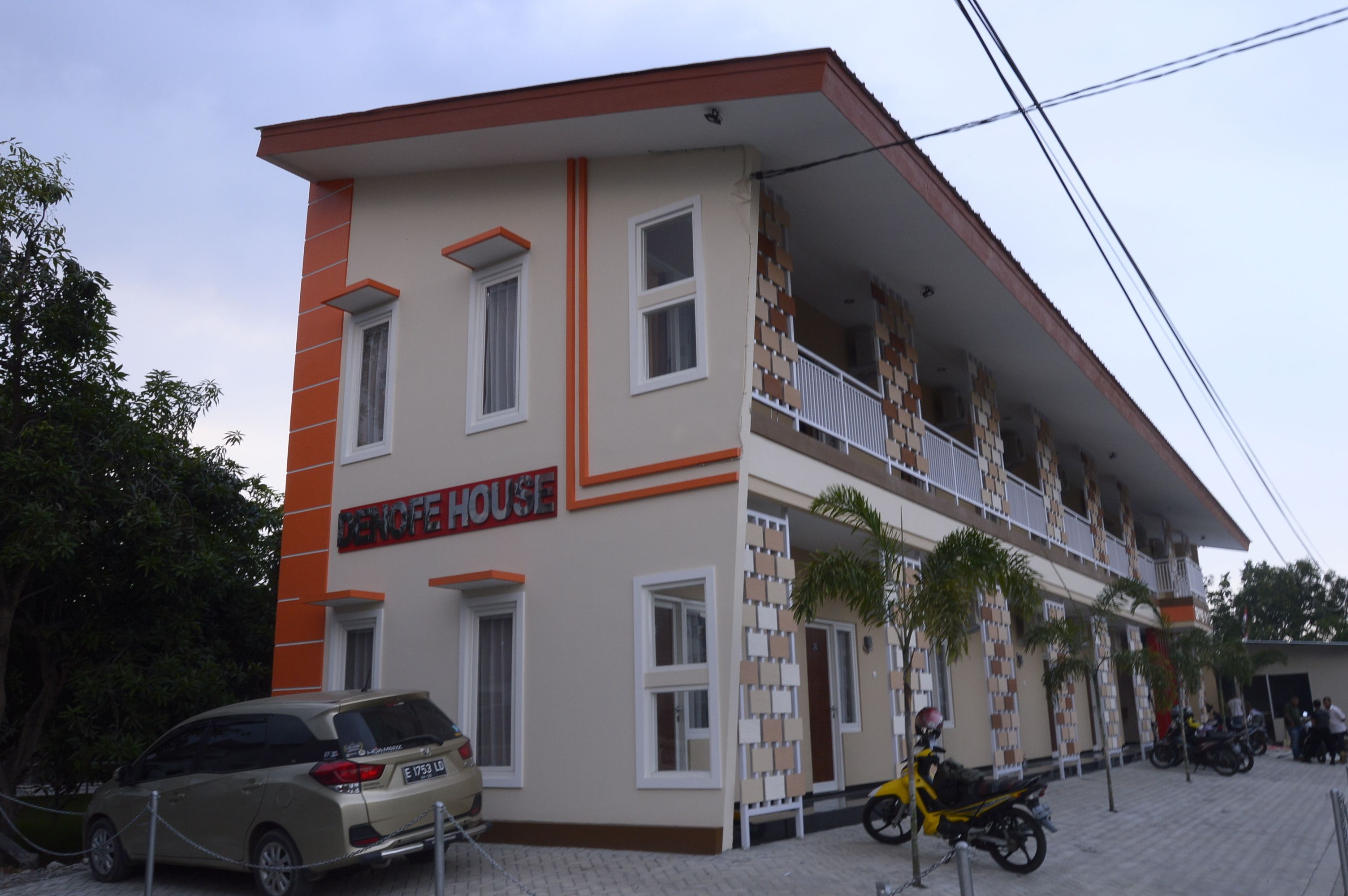 A two-story building with a sign reading "DANCE HOUSE".