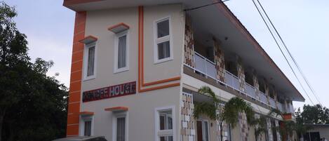 A two-story building with a sign reading "DANCE HOUSE".