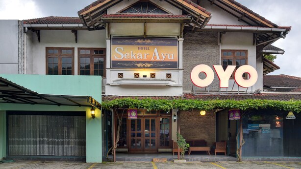 A hotel named "Sekar Ayu" with a prominent "OYO" sign, a traditional architectural style, and a covered entrance area. - Hotel Sekar Ayu (Yogyakarta)