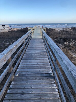 A wooden boardwalk leading to a beach with a clear sky. - Beachfront Surfside Home Gulf Views, Wraparound Decks, King + Bunks, Sleeps 12 (Freeport)