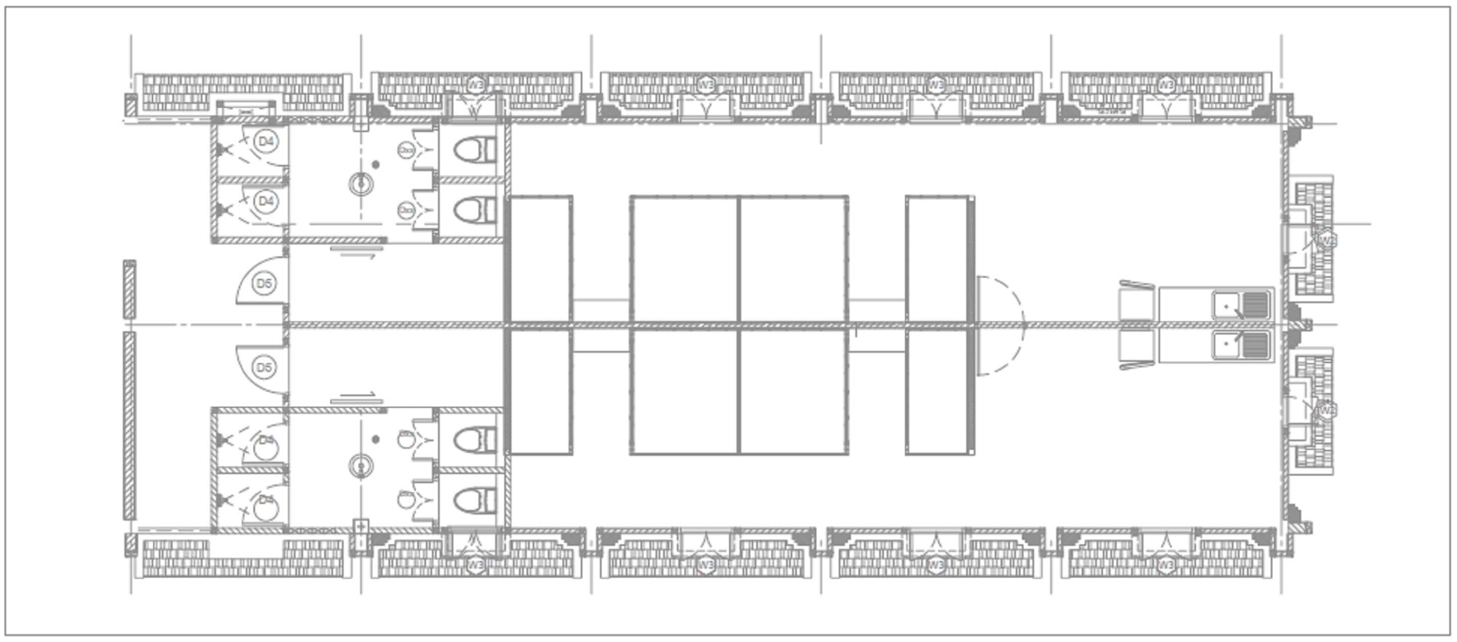 Plano de distribución de un hotel que muestra varias habitaciones, un vestíbulo central y un comedor.