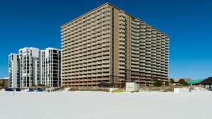 A high-rise hotel with multiple floors, balconies, and a beach view. - Pelican Beach Resort, Directly on the Beach w/breathtaking View (DESTIN)
