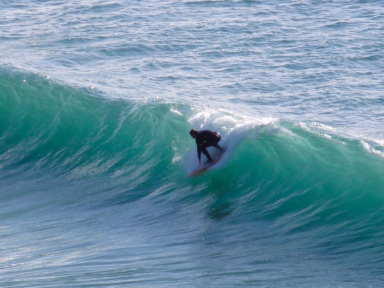 A surfer riding a wave.