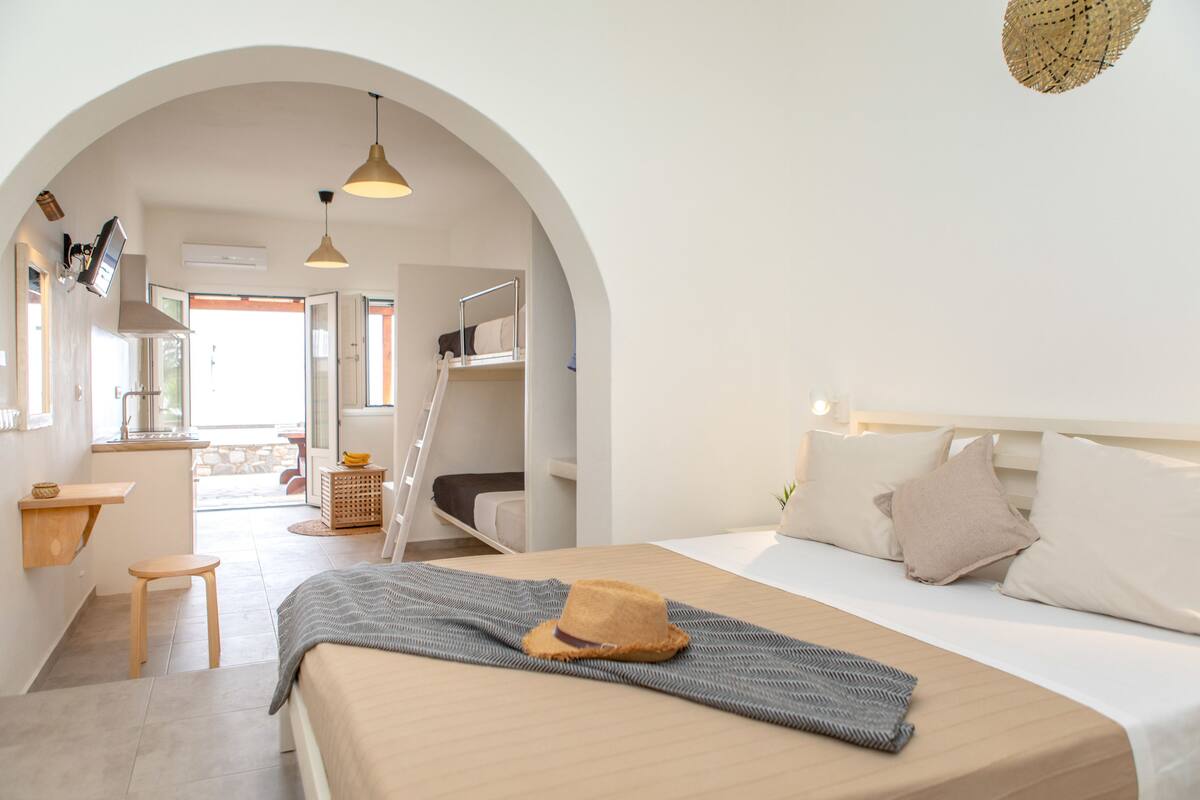 Quadruple Room, Partial Sea View | Hypo-allergenic bedding available, pillowtop beds, in-room safe, desk