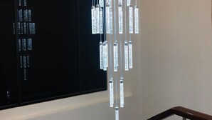 A modern interior with a unique hanging light fixture and a staircase. - Treasure Island Hotel (Masbate City)
