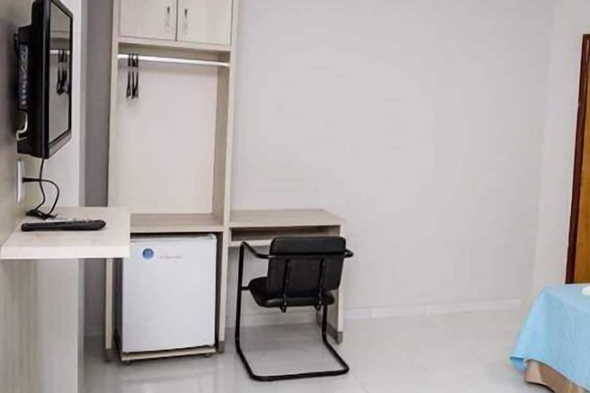 Minibar, desk, blackout curtains, iron/ironing board