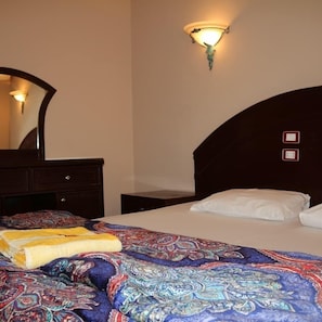 Apartment, 1 Bedroom, Garden View | 1 bedroom, minibar, blackout curtains, bed sheets
