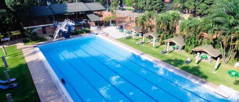 Outdoor pool, open 6:00 AM to 10:00 PM, free cabanas, pool umbrellas