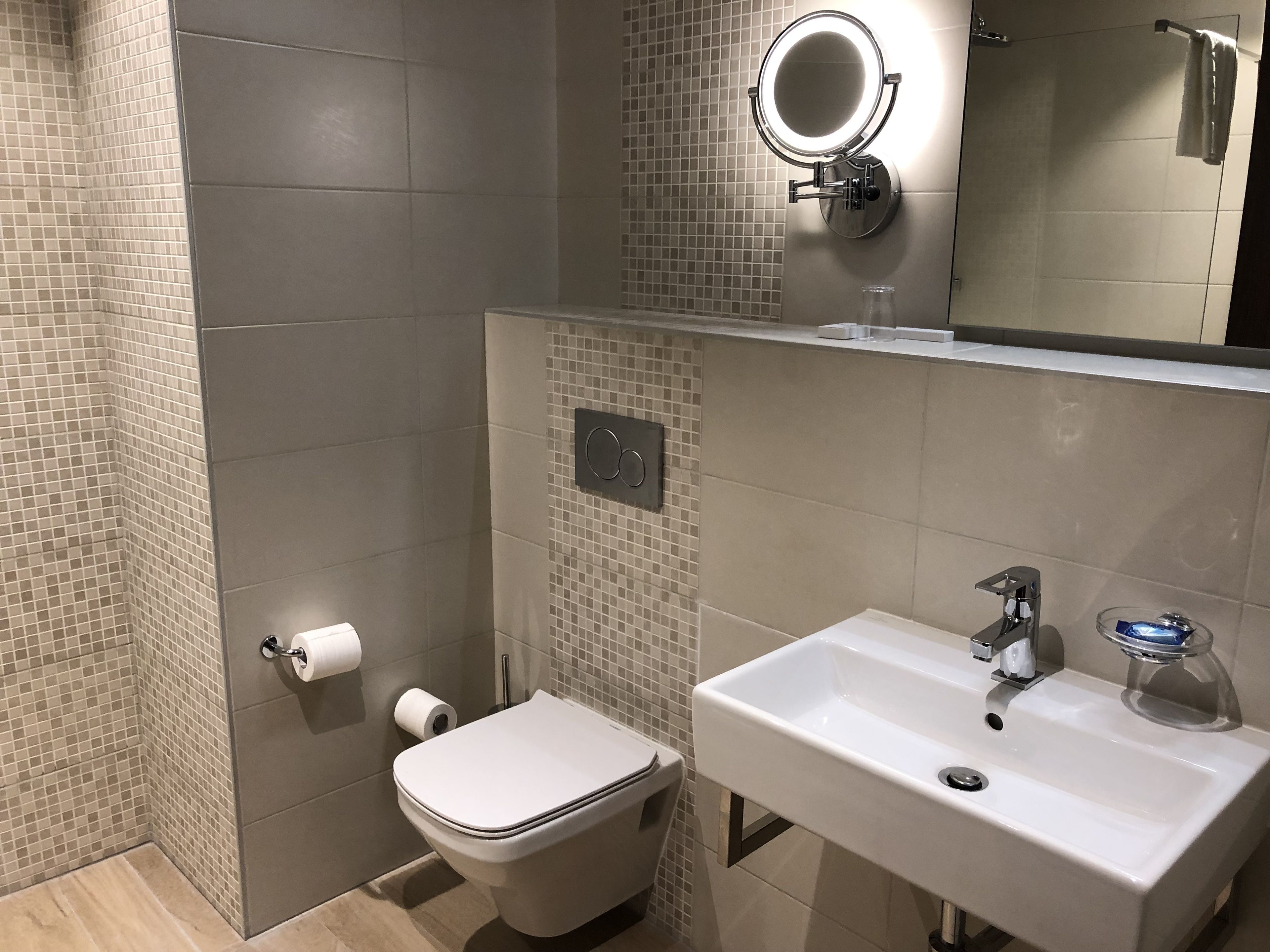 comfort single room, city view | bathroom | free toiletries, hair dryer, bathrobes, slippers