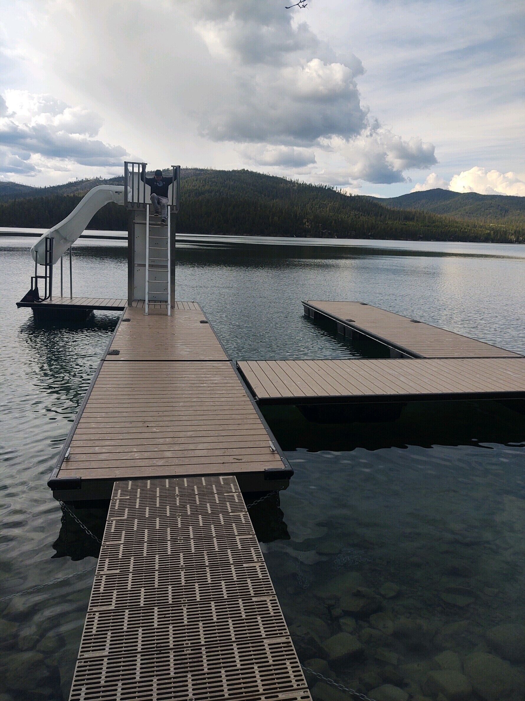 Waterfront w/ Water Slide, Rock Climbing Wall & Ice Fishing Shanty in Winter
